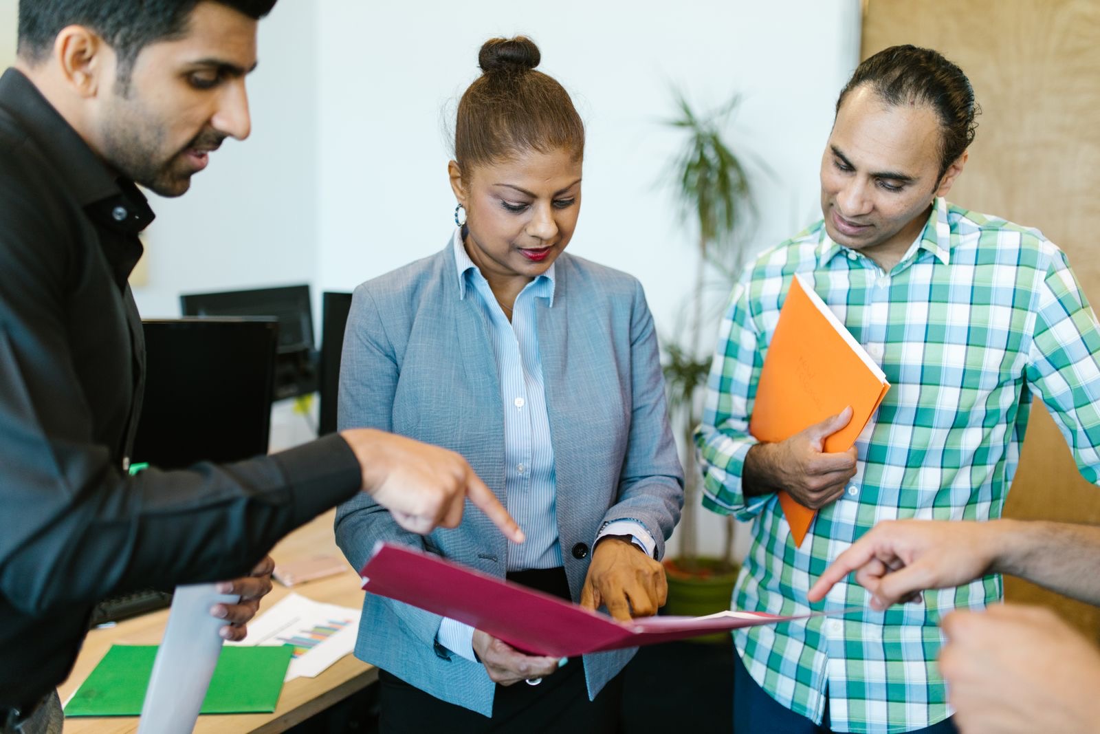 Colleagues going through a file together