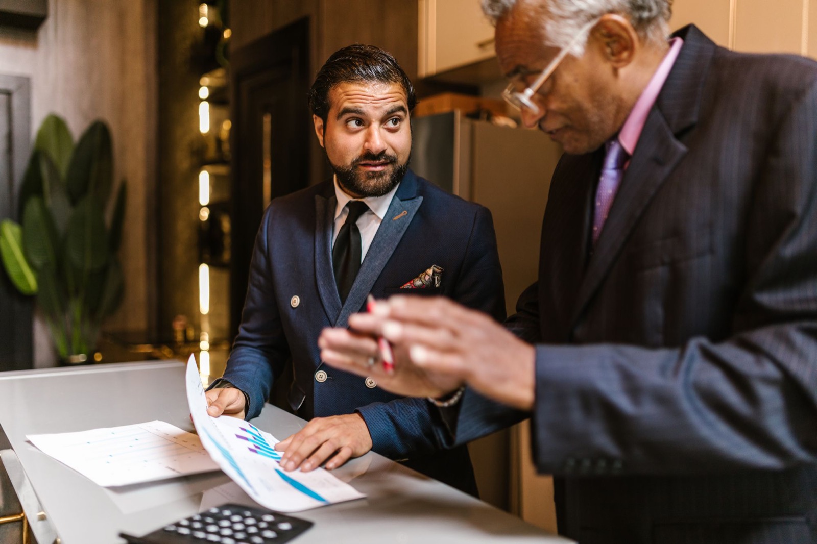 Two colleagues going over a printed chart report