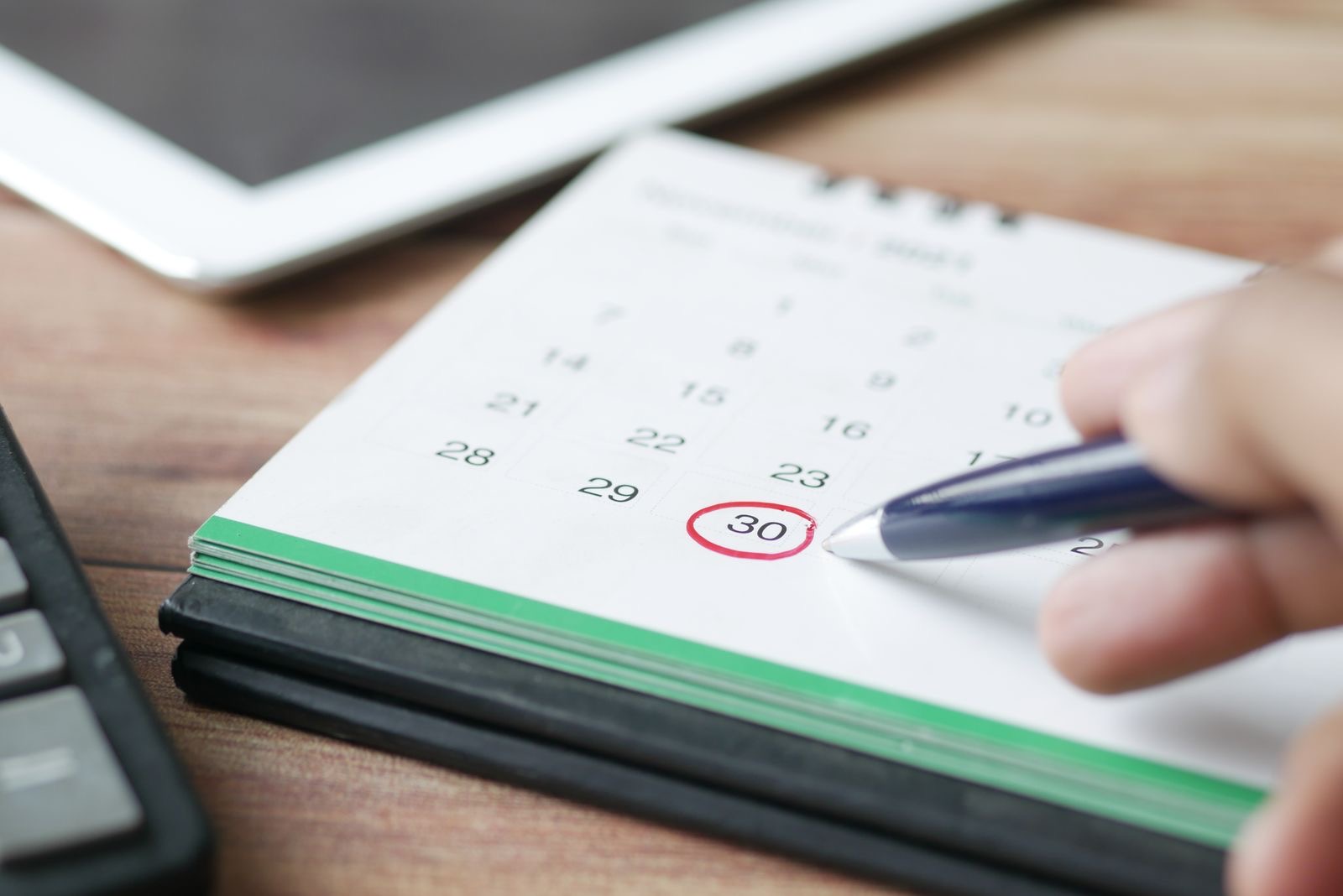 A date circled on a desk calendar