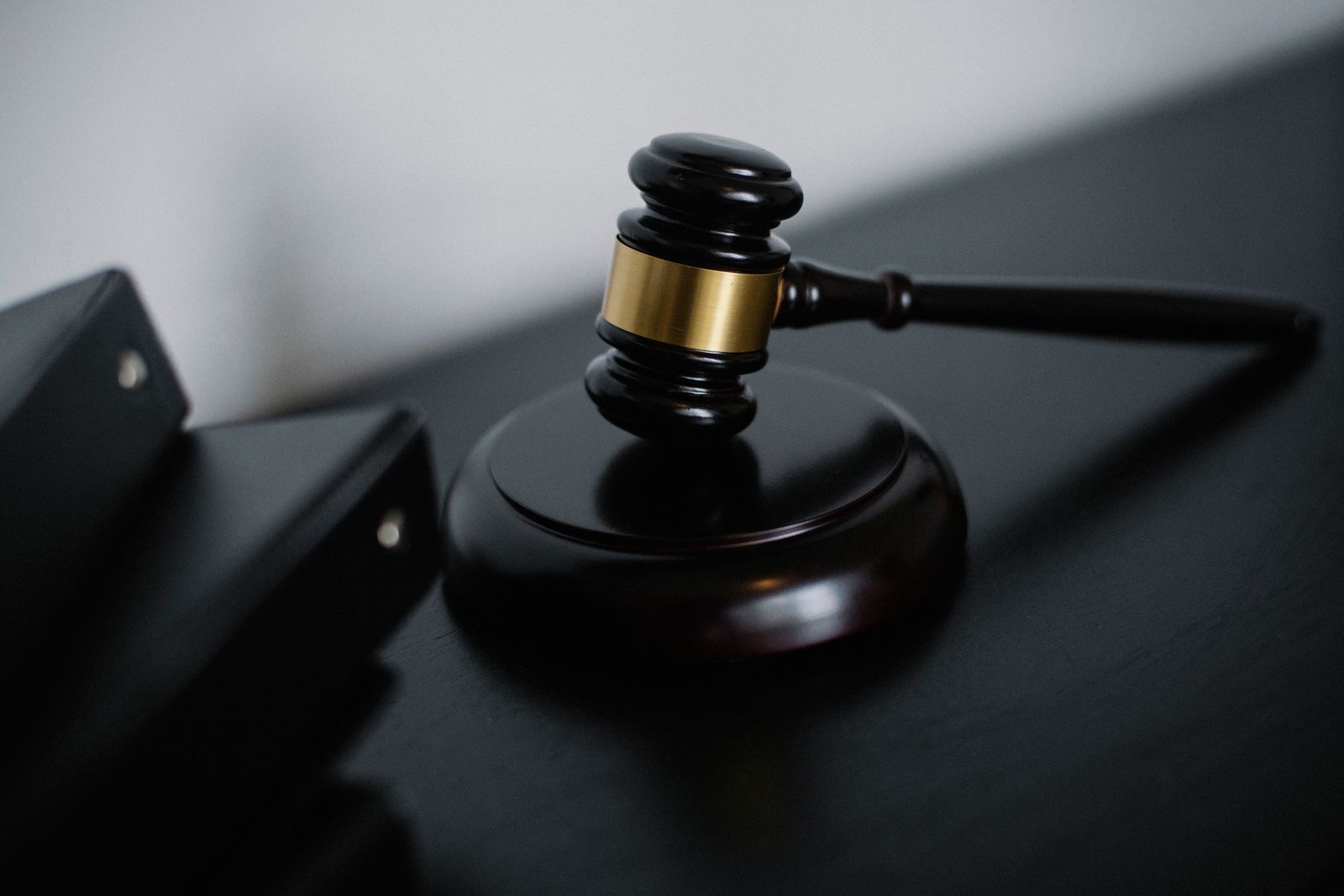 A judge’s gavel beside case folders